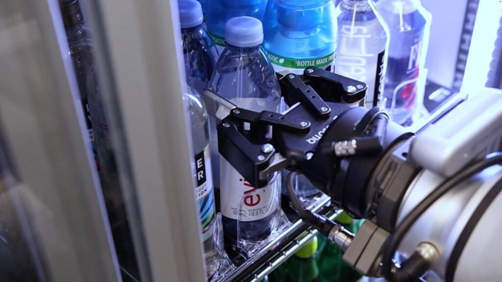 A robot inside the Robot run store VenHub is changing the future of shopping by taking a drink from the fridge and handing it to the customer.