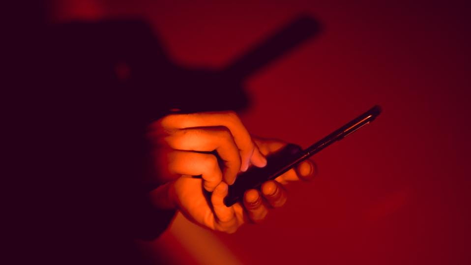 Smartphone user sees a critical warning symbol, highlighting Google’s alert to avoid unsafe mobile networks.