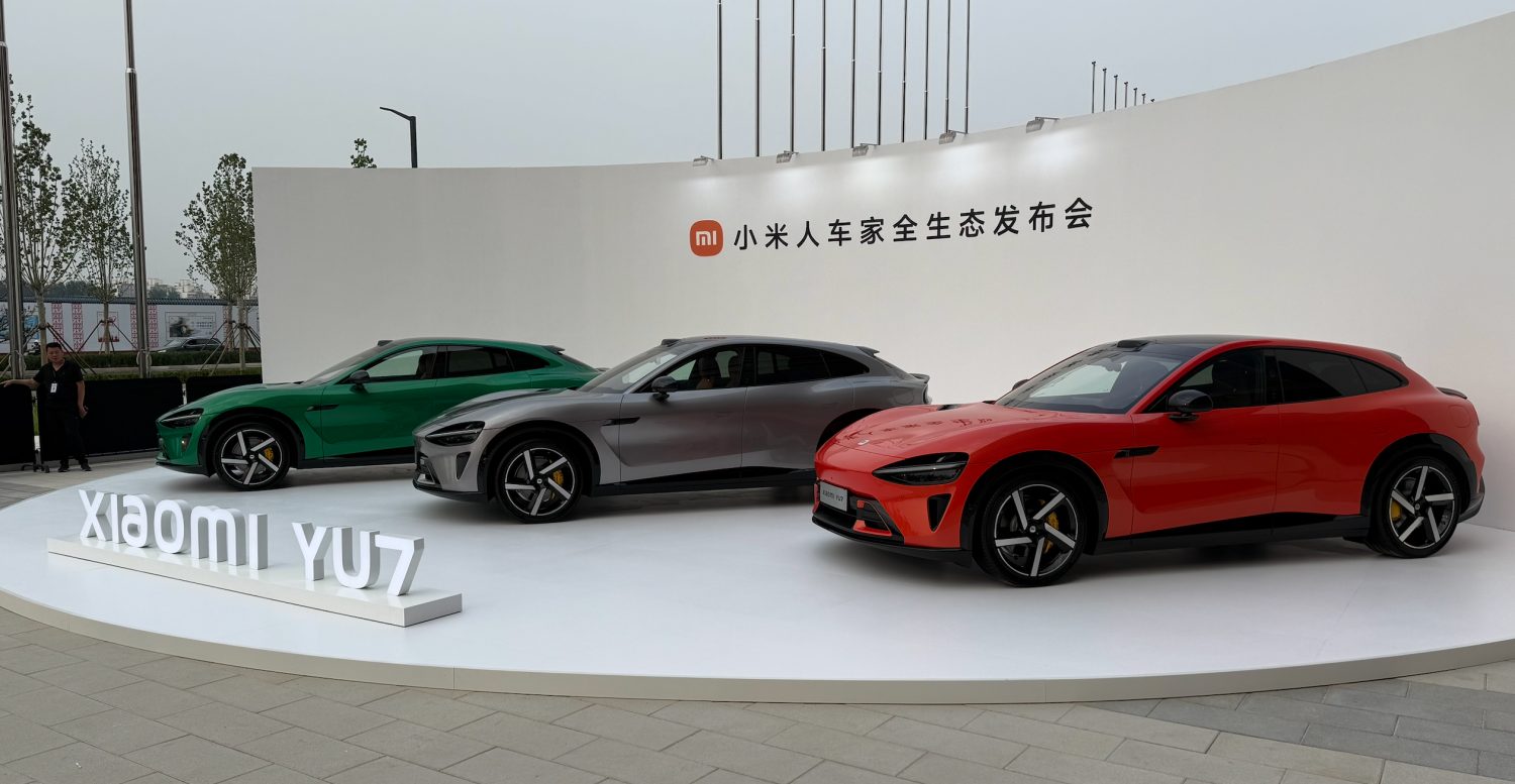 Xiaomi Tesla killer SU7 electric cars showcased in green, grey, and red colors during official launch event.