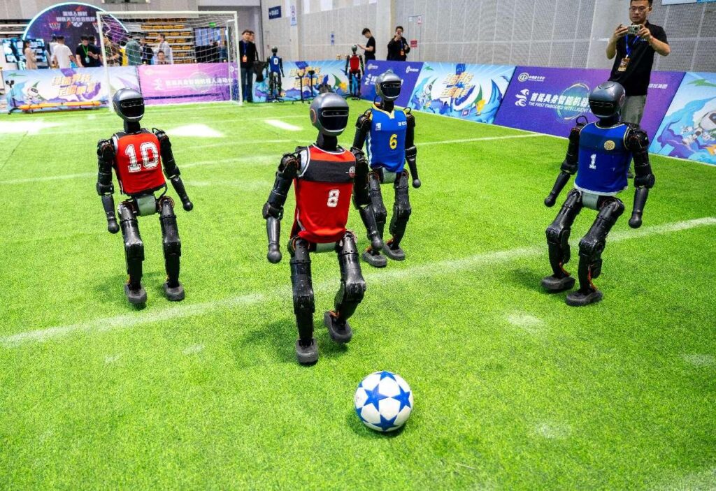 Advanced humanoid robots guided by AI showcase teamwork during a thrilling soccer match.