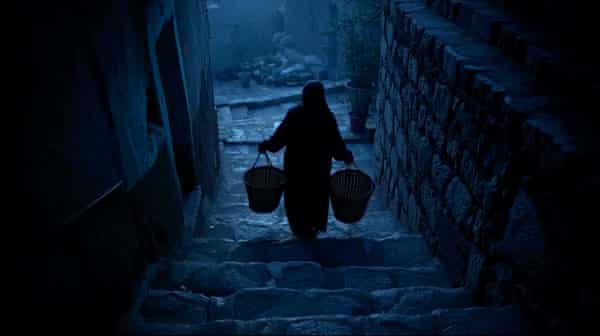 A still from Midnight Drop, showing the woman who feeds stray cats in Tehran in the dead of night.
