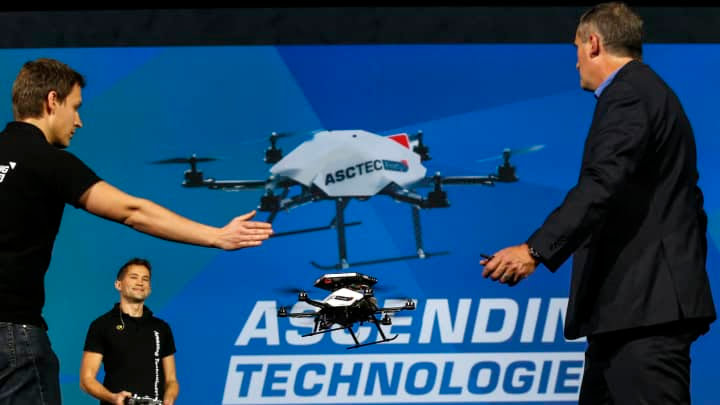 a man and woman with a drone