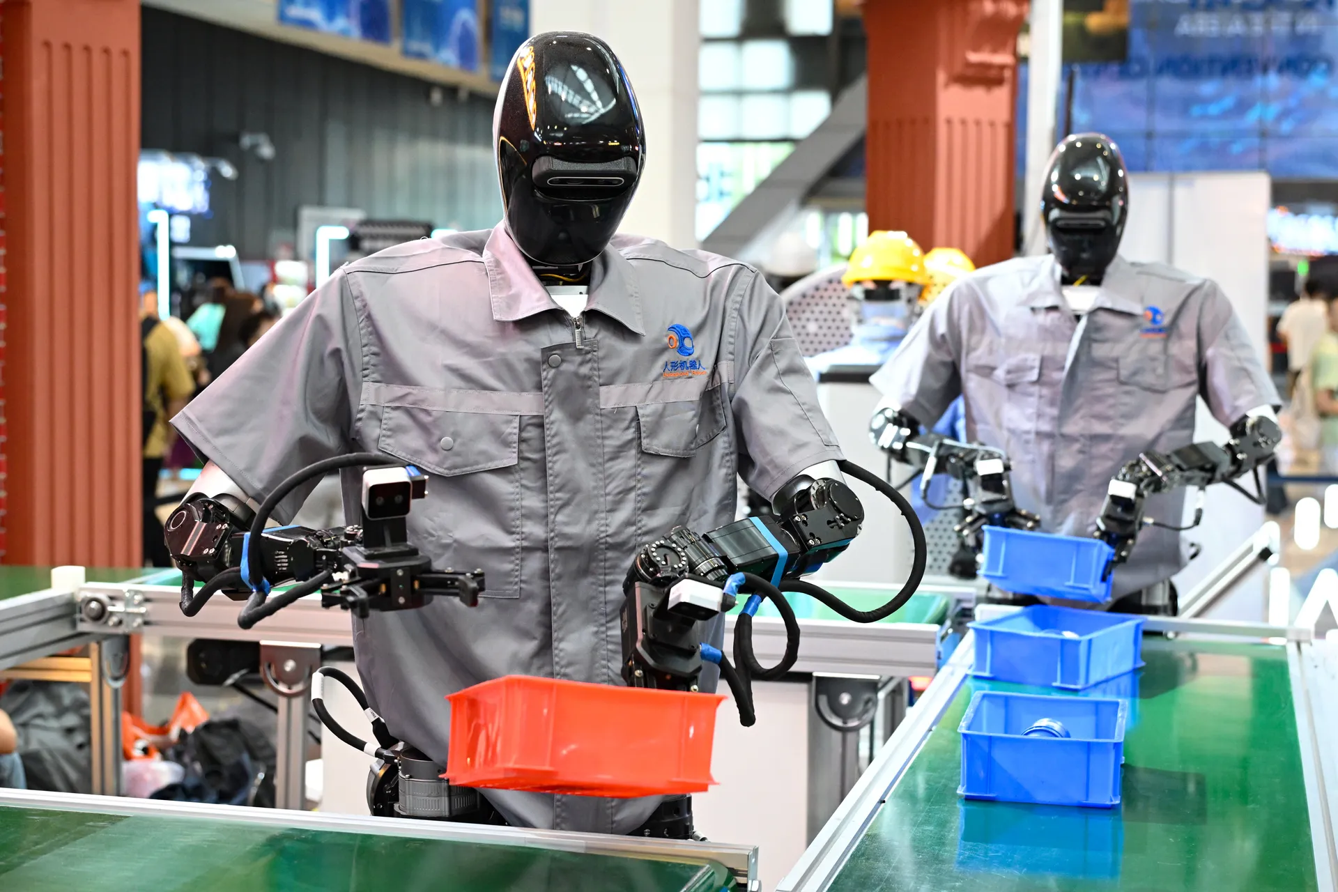 humanoid robots performing customer service tasks, highlighting automation in action — a visual example of jobs destroyed by AI.