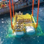 A futuristic underwater data center being constructed near Shanghai, China, showcasing innovation in marine-based cooling and digital infrastructure.