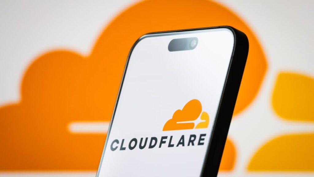Cloudflare logo displayed on a smartphone screen, reflecting Cloudflare blocking AI crawlers by default.