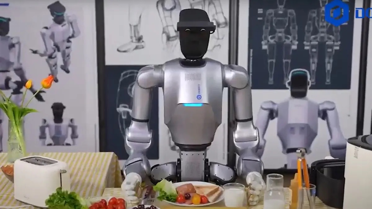 Dobot humanoid robot working in a modern kitchen cooking food remotely