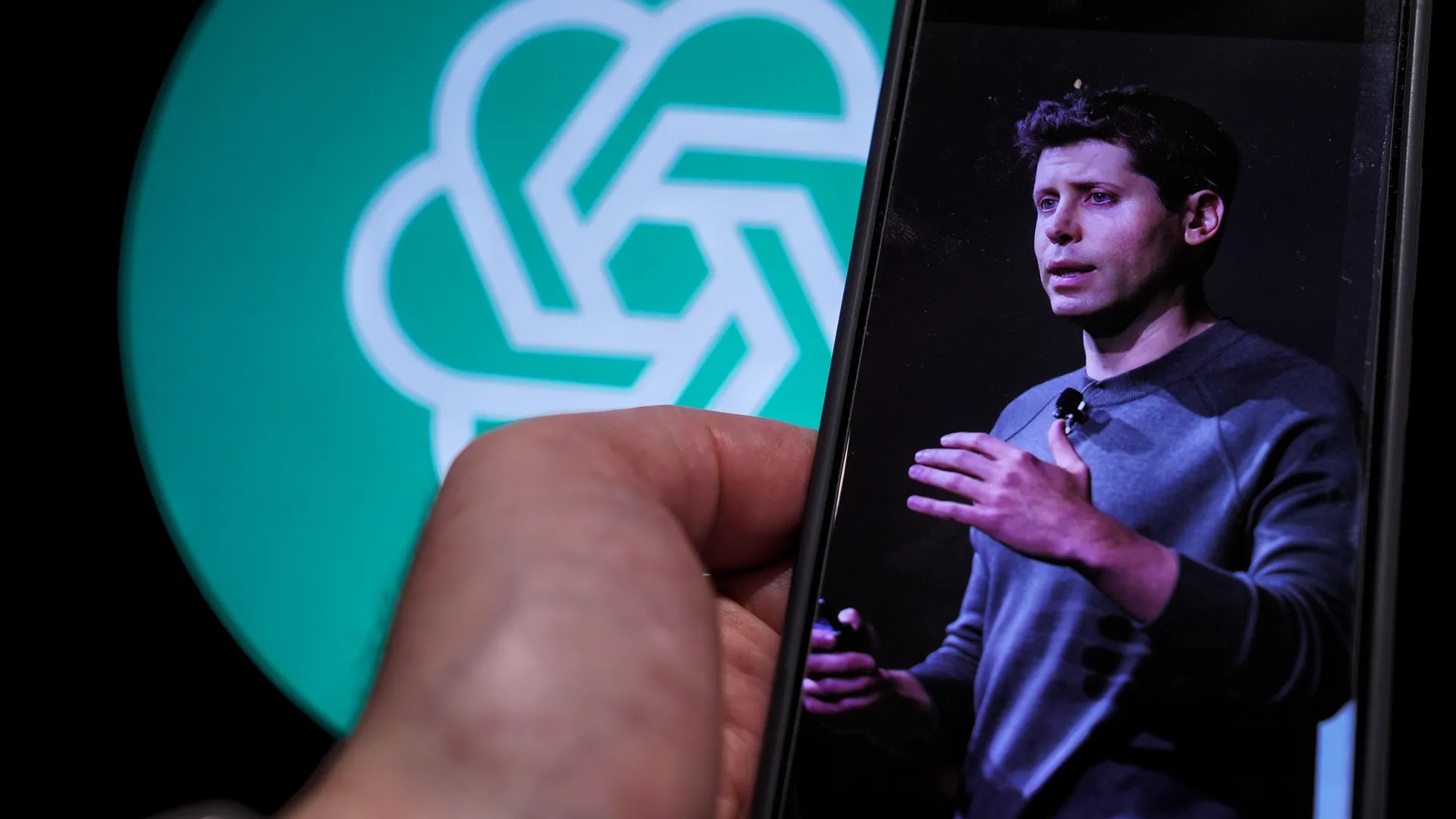 Sam Altman expressing concern with ChatGPT logo in the background, reflecting his fear of GPT-5's potential.