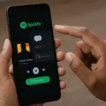 A person using the Spotify mobile app with the new direct messaging feature to share music.