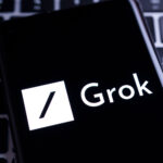 Grok logo displayed on smartphone screen showcasing Grok Imagine text to video AI innovation by Elon Musk.