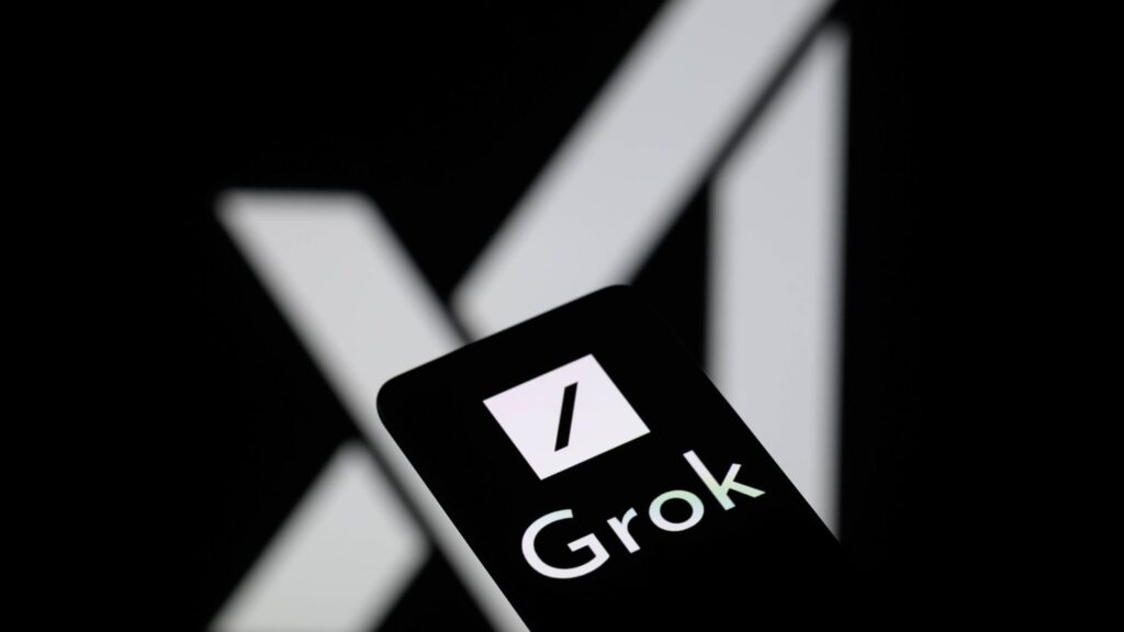 Close-up of Grok AI logo on smartphone screen with X (Twitter) logo blurred in the background, highlighting upcoming ads on Grok.