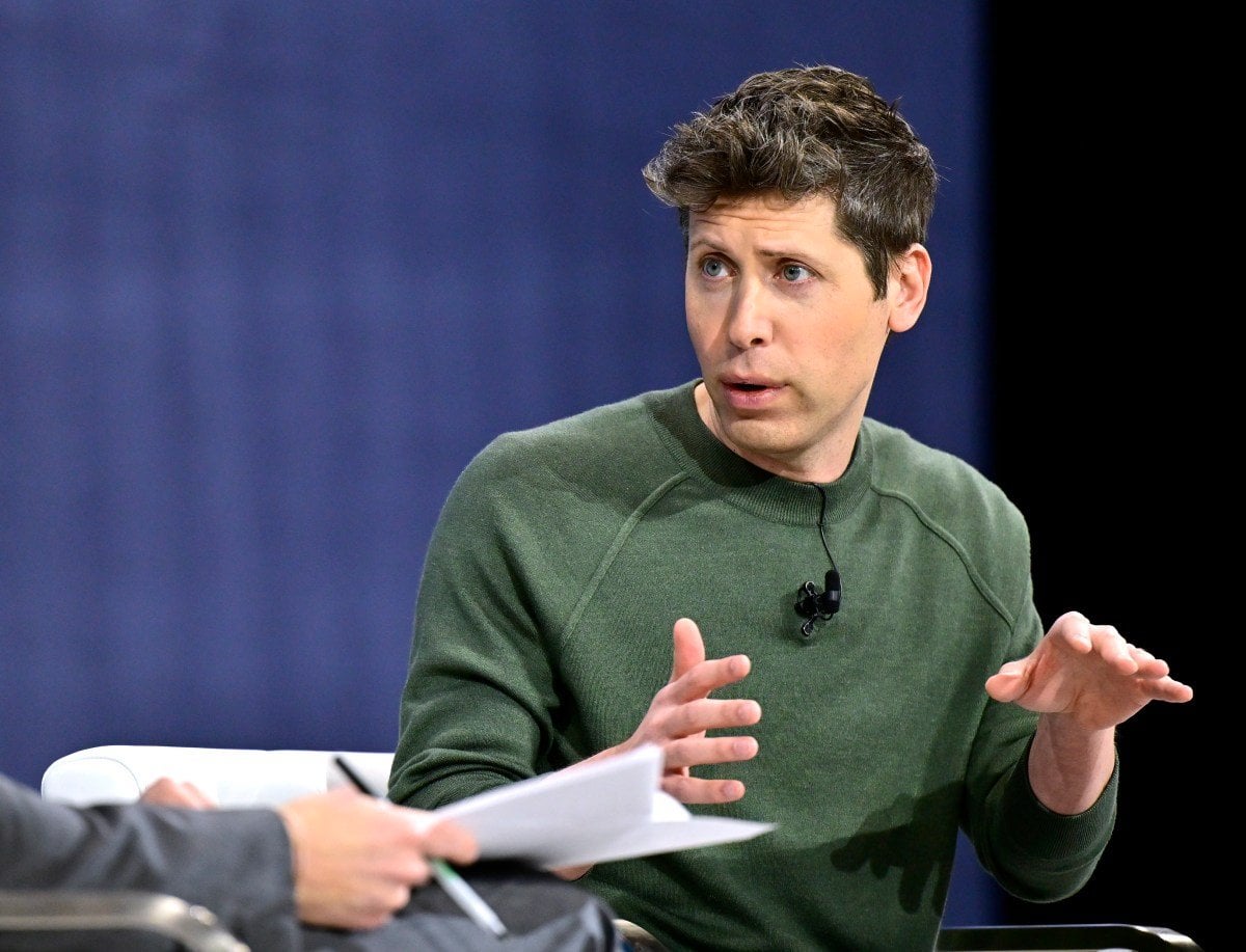 Sam Altman discussing OpenAI open source strategy during a press briefing