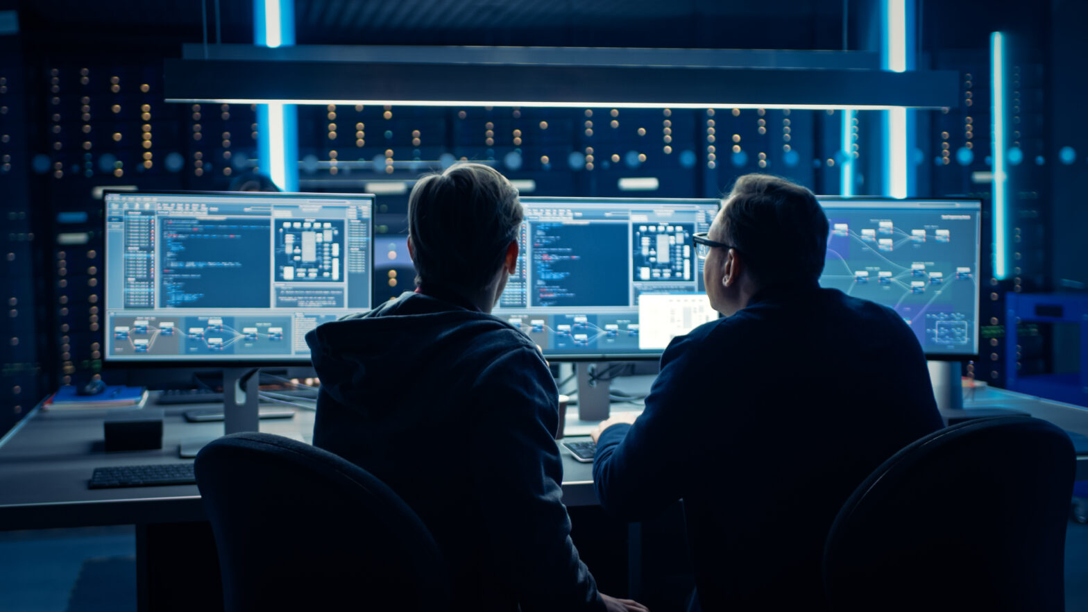 Two professionals collaborating on a quantum computing project with cloud integration, representing the Microsoft quantum cloud strategy.