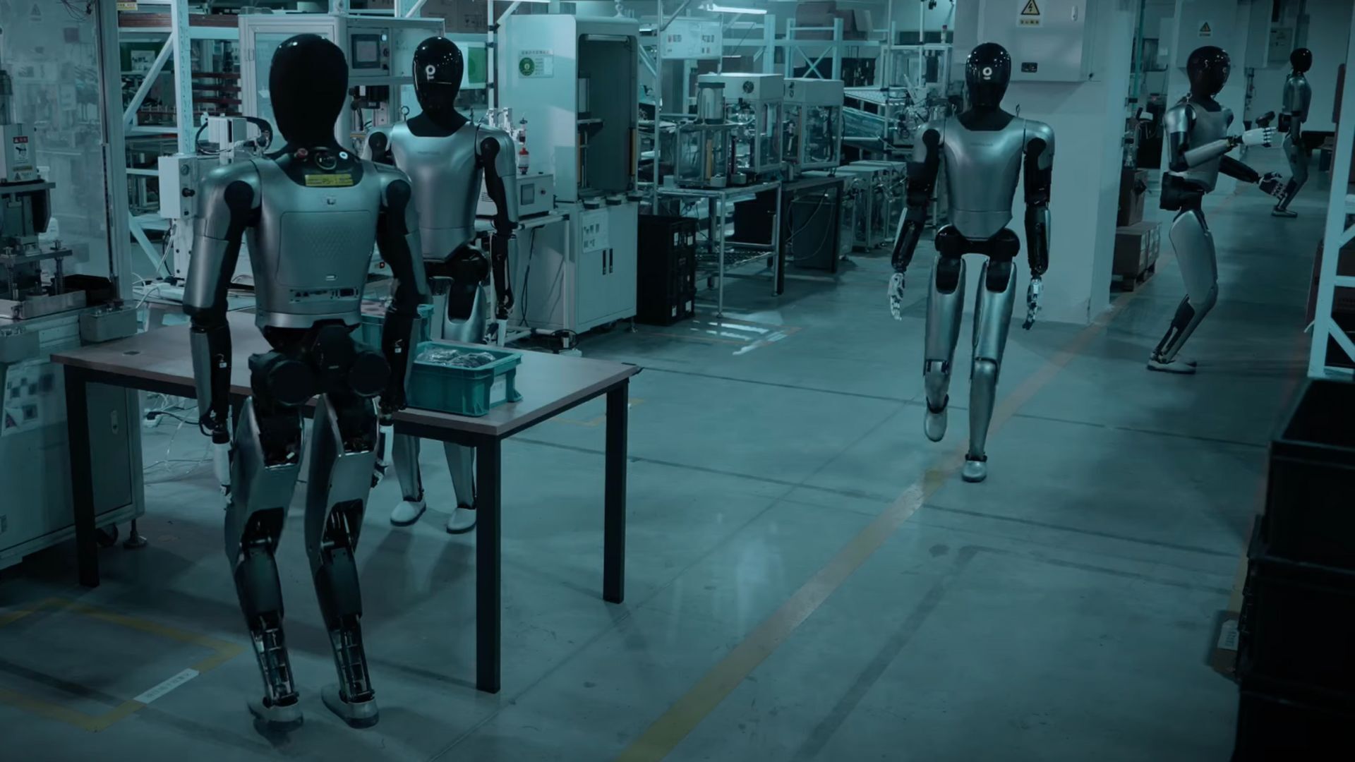MagicBot humanoid robots operating in a high-tech Chinese robotics factory.