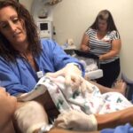 Female humanoid robot giving birth inside an artificial womb system, representing the world’s first robot that could give birth to human baby