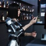 Humanoid service robot assisting customers at the front desk of a restaurant during the Robot Shopping Festival inside the world’s first humanoid robot 4S store, Robot Mall in Beijing.
