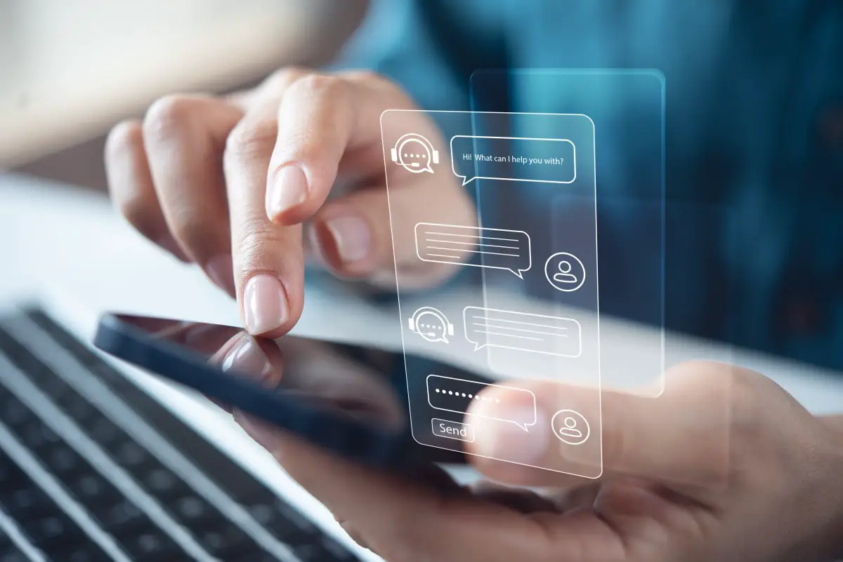 person interacting with an AI chatbot on a smartphone while Meta contractors review conversations to improve artificial intelligence.