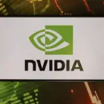 Nvidia logo on smartphone screen with stock market data background, representing bullish options trade opportunities in Mag 7 stocks after earnings