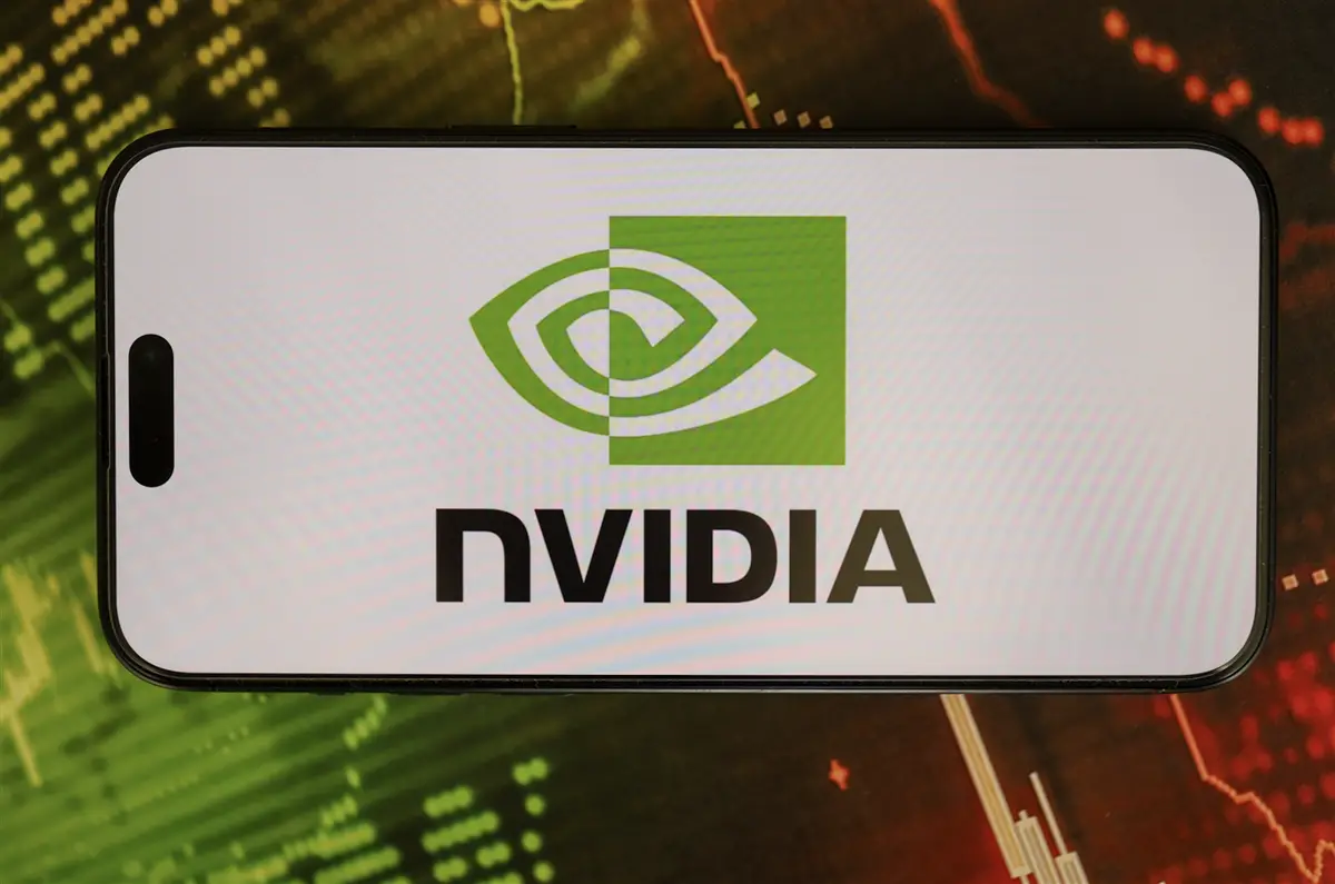 Nvidia logo on smartphone screen with stock market data background, representing bullish options trade opportunities in Mag 7 stocks after earnings