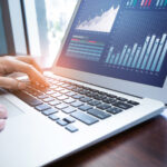 Financial analyst reviewing stock charts and market data related to Nvidia earnings expectations 2025.