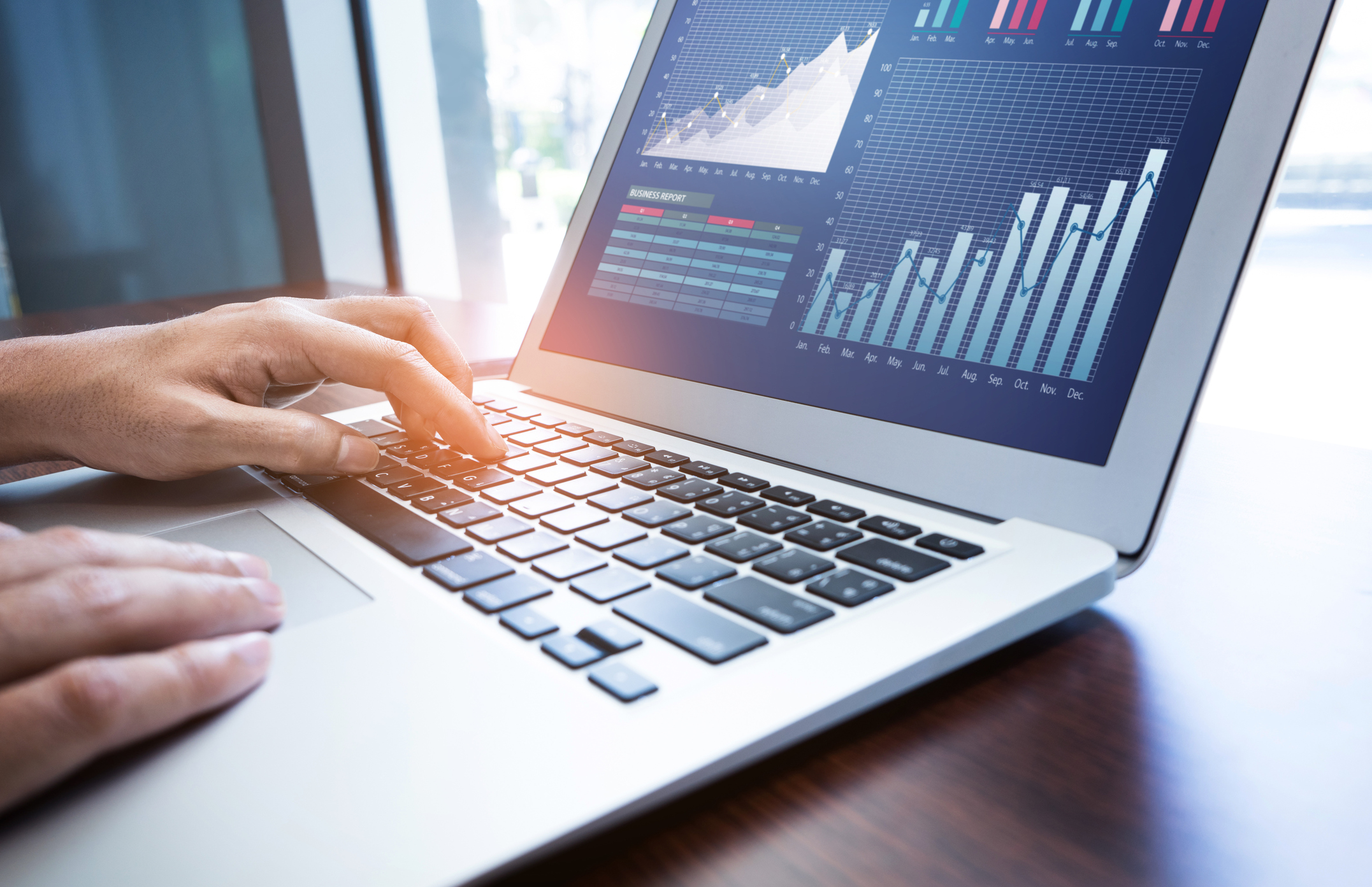 Financial analyst reviewing stock charts and market data related to Nvidia earnings expectations 2025.