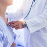 Doctor using an AI stethoscope on a patient to detect heart conditions in just 15 seconds.