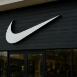 Exterior view of a Nike store with the iconic swoosh logo, representing company performance as Nike profit falls 31 percent.