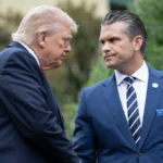 US Defence Secretary Pete Hegseth and President Donald Trump speaking at Marine Corps Base Quantico during a military summit focused on leadership and warrior ethos.