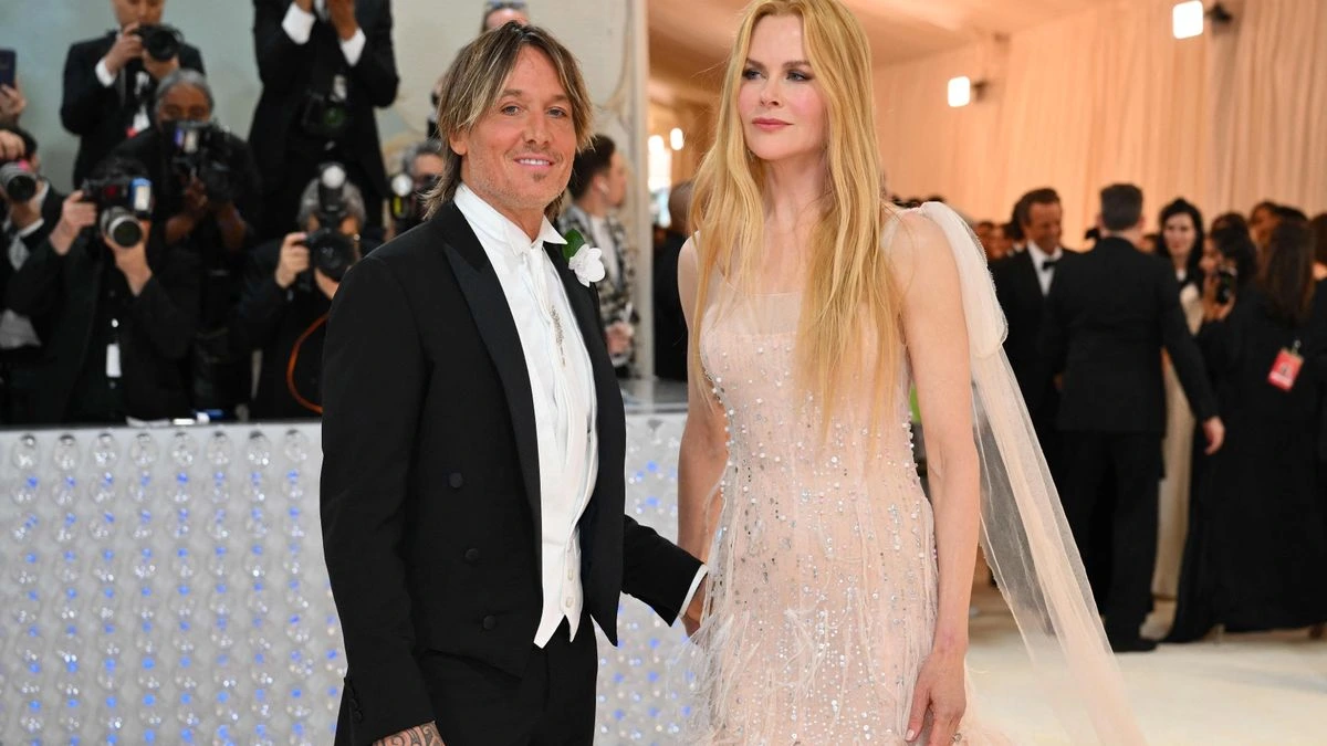Nicole Kidman and Keith Urban looking at each other during a red carpet event, symbolizing their 19-year marriage before separation.