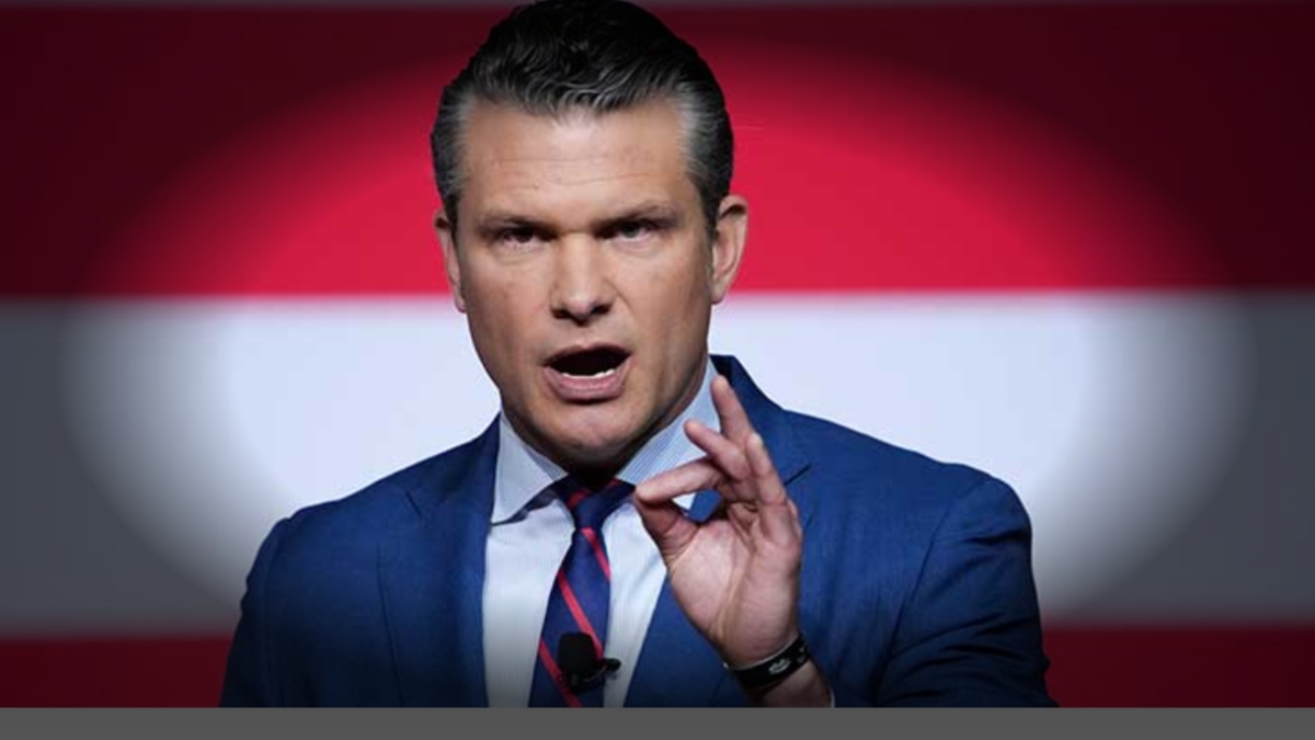 U.S. Defense Secretary Pete Hegseth speaking at a press briefing on Caribbean strikes against drug trafficking vessels