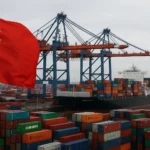 A large cargo ship docked at a German port with cranes and shipping containers, featuring a Chinese flag in the foreground symbolizing the shift in China Germany trade.