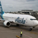 Alaska Airlines aircraft at the gate as the airline restores operations after a nationwide IT outage at U.S. airports.