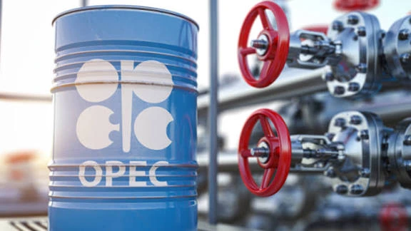 Blue OPEC oil barrel near refinery valves representing OPEC+ oil output increase decision for November 2025