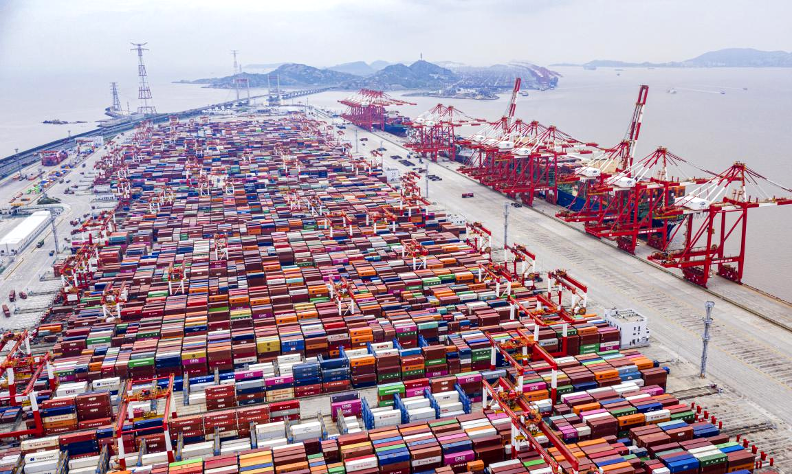 Aerial view of a busy container port in China reflecting strong exports amid the China economy slowdown.