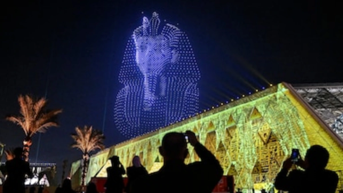 Spectacular drone light show depicting a pharaoh’s face during the Grand Egyptian Museum opening ceremony near Giza Pyramids.