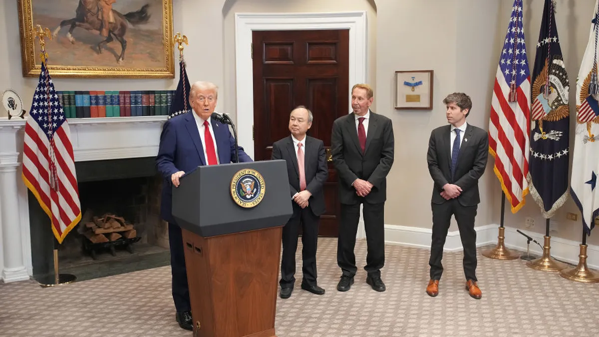 Stargate project leaders including OpenAI, Nvidia, and Oracle executives standing with President Trump during the AI infrastructure announcement