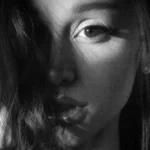 Black and white dramatic portrait of Ariana Grande featured on the cover art and promo for her eighth studio album Petal.