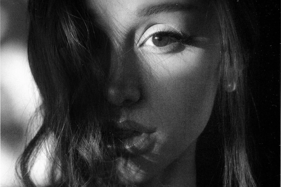 Black and white dramatic portrait of Ariana Grande featured on the cover art and promo for her eighth studio album Petal.