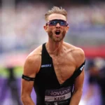 Josh Kerr celebrates after breaking the men's mile world record with a time of 3:42.66 at the London Diamond League at London Stadium on July 18, 2026.