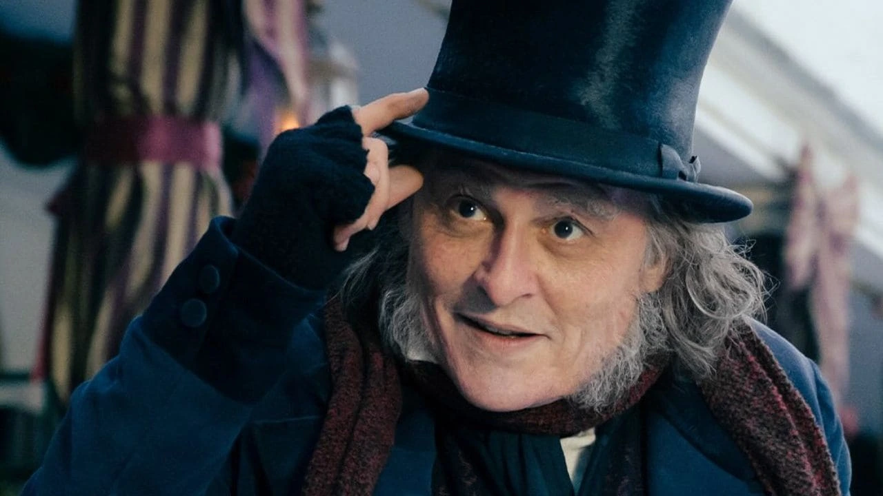 Johnny Depp as Ebenezer Scrooge in the first trailer for Ebenezer: A Christmas Carol, wearing a top hat and Victorian costume during the gothic holiday film.