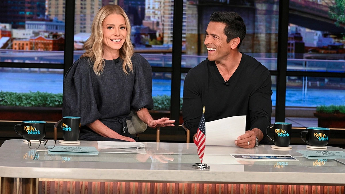 Kelly Ripa and Mark Consuelos on the set of Live with Kelly and Mark before Ripa's temporary absence following her gum graft surgery recovery