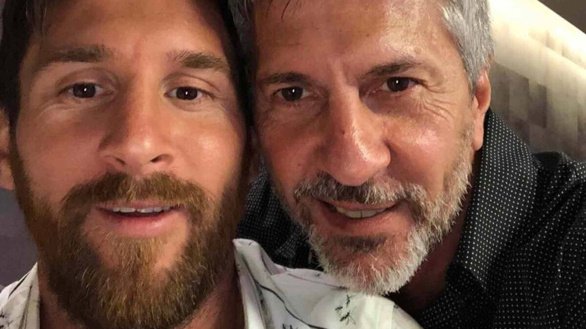 Football star posing with his father in a close-up selfie