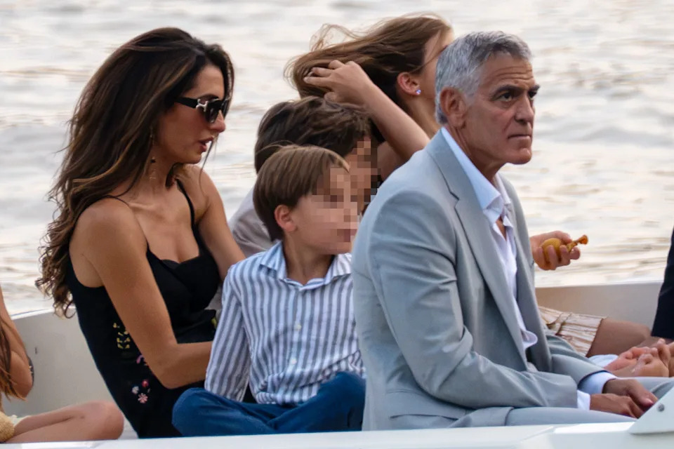 George and Amal Clooney with their twins during a rare family outing on a boat in Lake Como, Italy