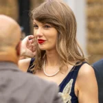 Taylor Swift short hair and signature bangs at a star-studded U.K. wedding