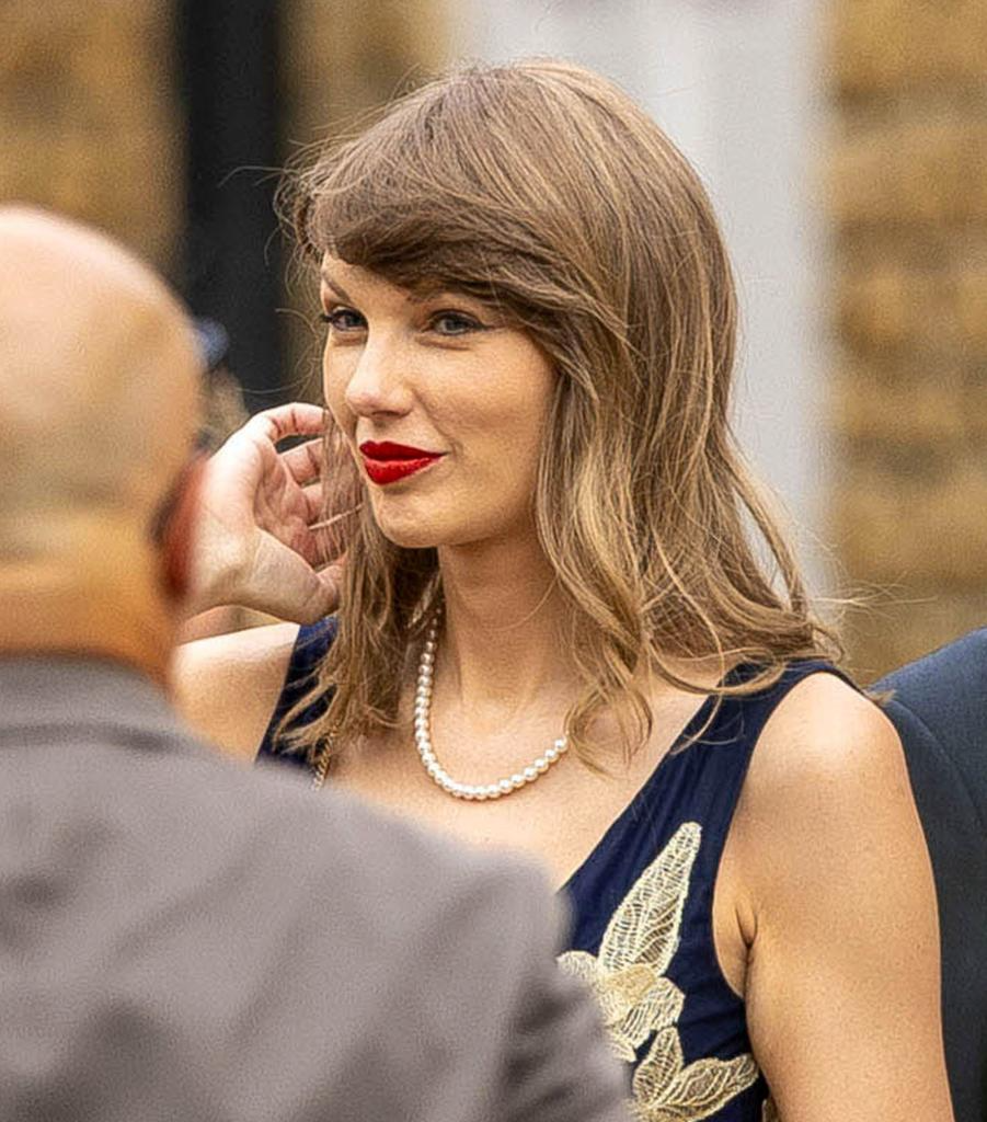 Taylor Swift short hair and signature bangs at a star-studded U.K. wedding