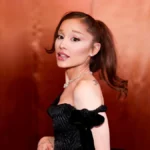 Ariana Grande poses in a black gown at a red carpet event amid her West End musical exit news
