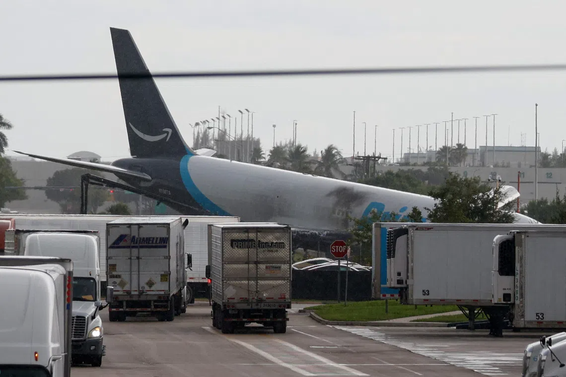 Amazon cargo plane Miami airport after 21 Air Flight 7598 overran the runway at Miami International Airport.
