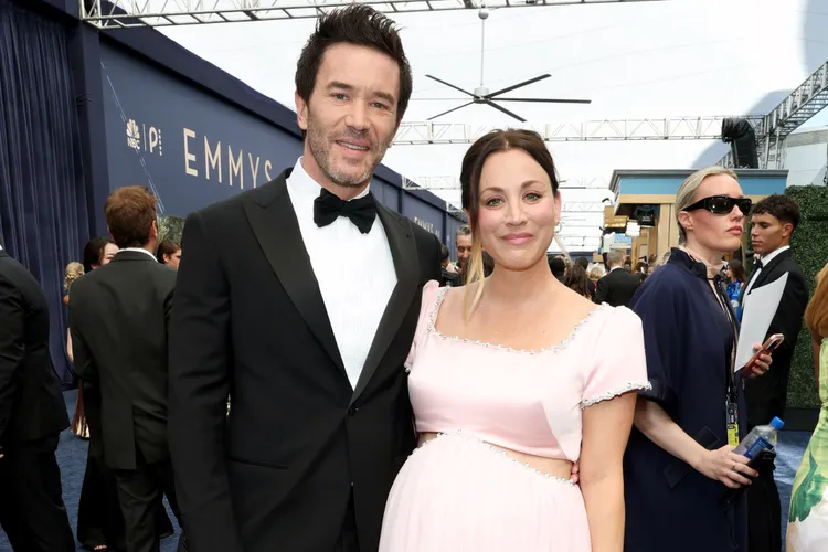 Kaley Cuoco and Tom Pelphrey at the 2026 Emmys red carpet, with Cuoco showing her baby bump in a pink gown