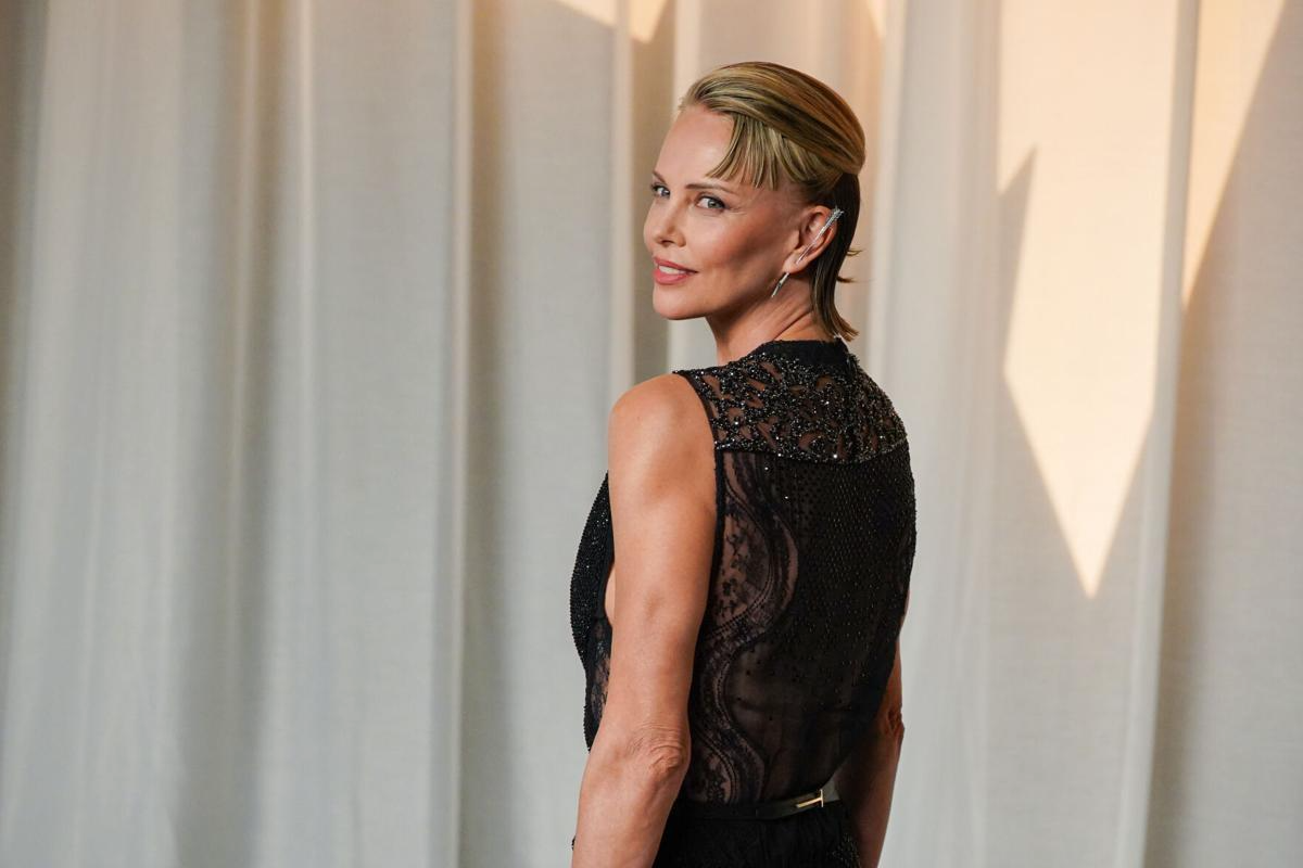Charlize Theron Stuns in Sheer Black Dress at Academy Museum Gala